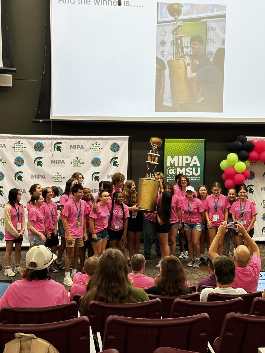 Students in Instructor Julia Satterthwaite’s ‘Art of Storytelling’ workshop held up the large, MIPA golden trophy and celebrated their win after completing a series of tasks and challenges throughout the five days on the last day of the camp on Jul. 24. 