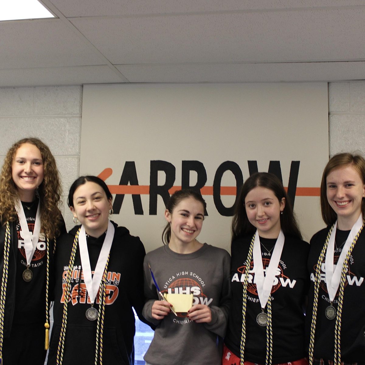 Photo of the Day #146!
It was a busy and celebratory morning in room 205 as the Arrow Staff held their induction ceremony for the Quill and Scroll National Honor Society: for High School Journalists. The five students inducted into Quill and Scroll were recognized for their strenuous work put into Utica High School's publications, with the seniors receiving cords and a medal for graduation day on May 11.