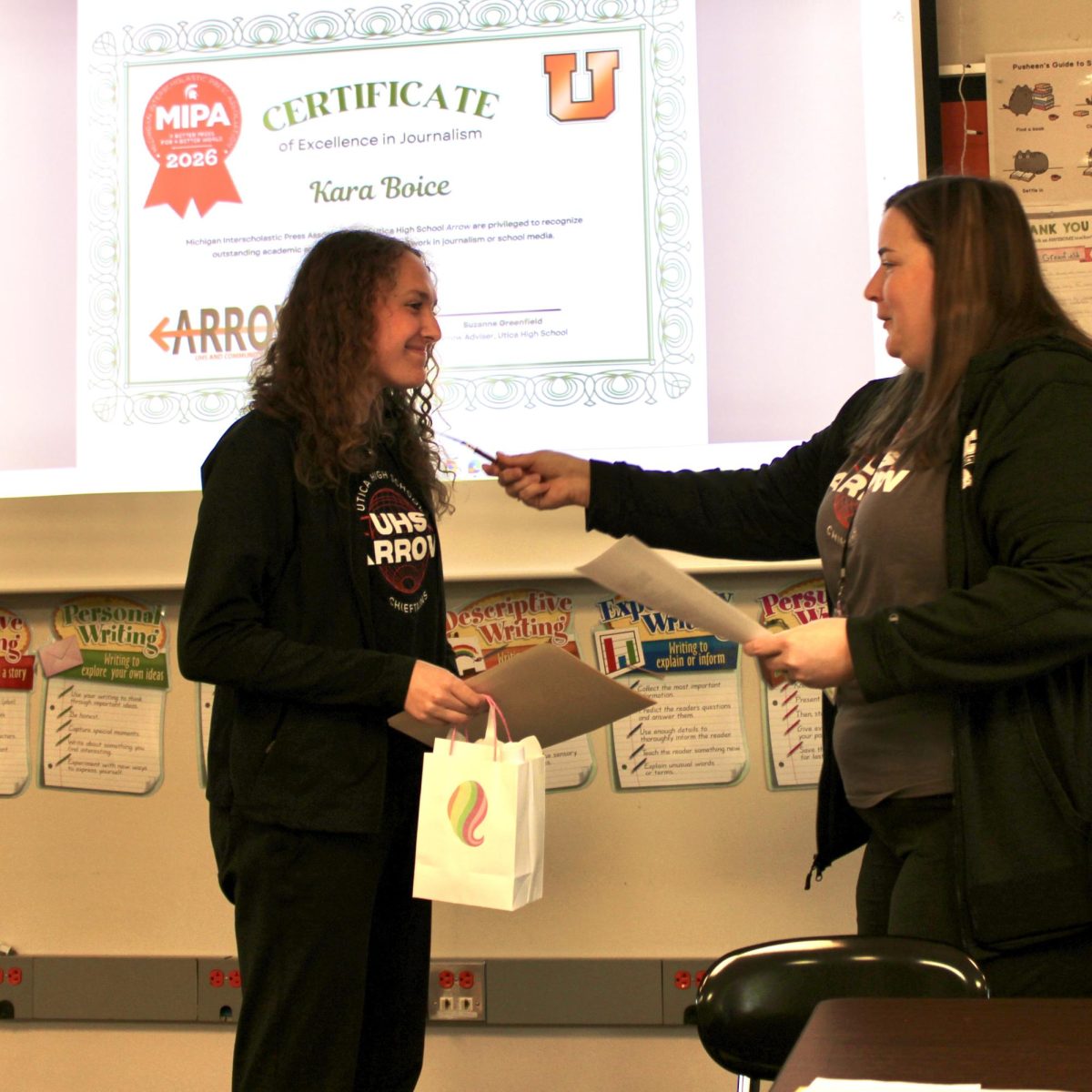 Photo of the Day #146!
It was a busy and celebratory morning in room 205 as the Arrow Staff held their induction ceremony for the Quill and Scroll National Honor Society: for High School Journalists. The five students inducted into Quill and Scroll were recognized for their strenuous work put into Utica High School's publications, with the seniors receiving cords and a medal for graduation day on May 11.