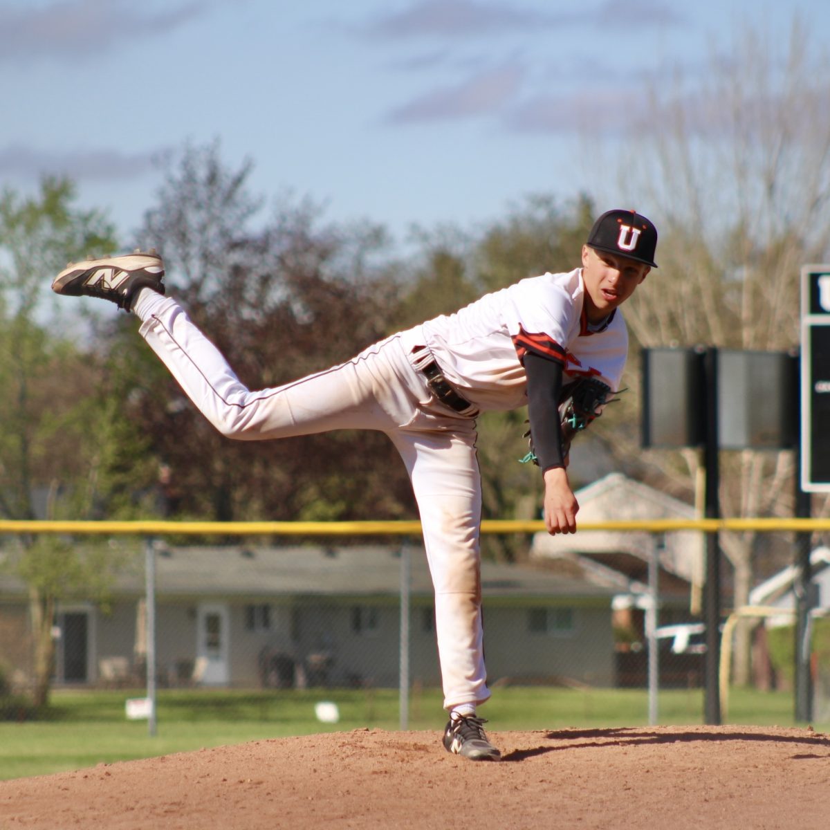 Photo of the Day #141!
After noticing some movement around first base as he prepares to throw the ball to the batter, JV pitcher sophomore Ethan Lesner, makes the split decision to throw the ball to his first basemen in hopes of getting his opponent from Saint Clair High School out on Apr. 28.
